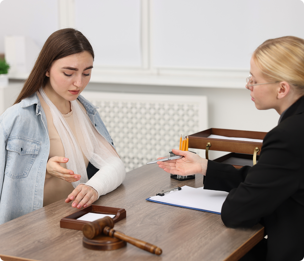 Injured woman consulting with lawyer