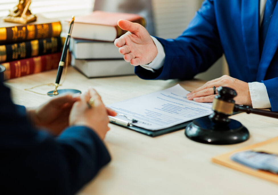 A client meets with a lawyer to discuss a legal case and seek professional representation for upcoming court proceedings.